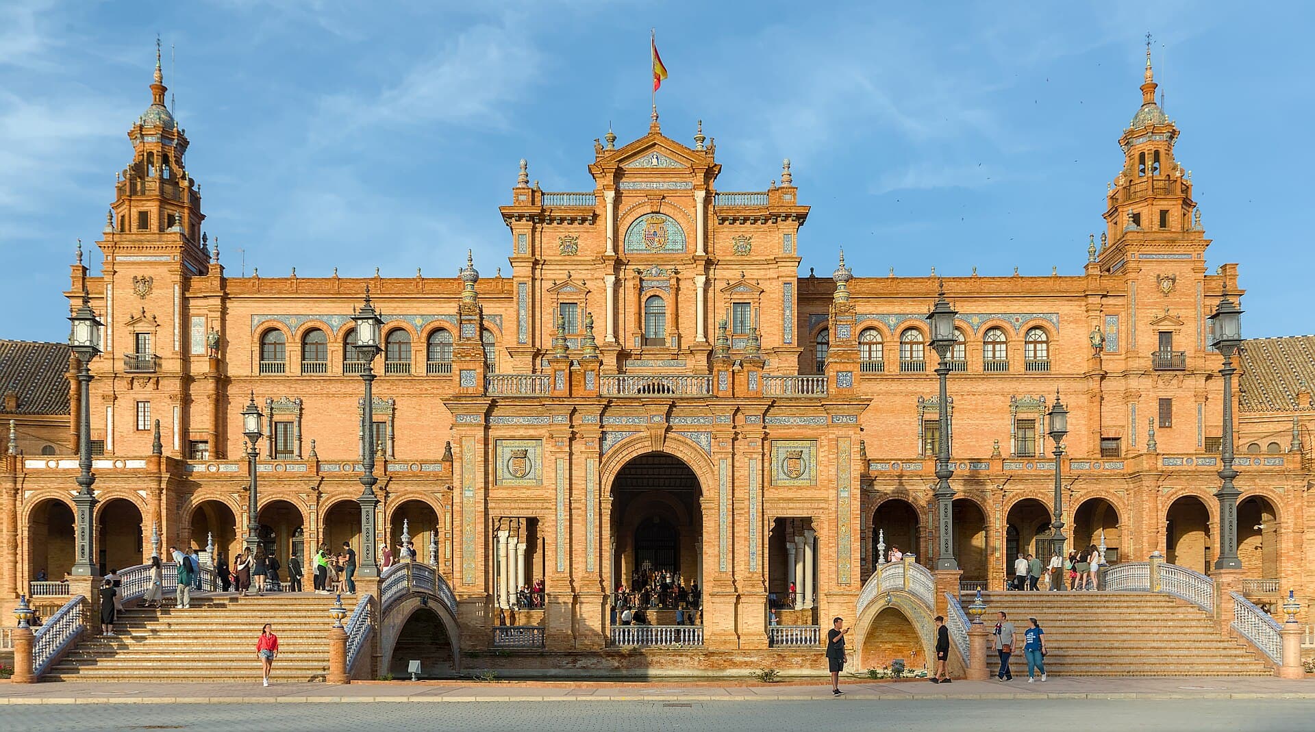The brick towers, arches, and canal bridges of Plaza de España in Seville
