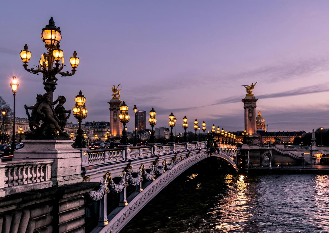 Pont Alexandre III in Paris lit at dusk
