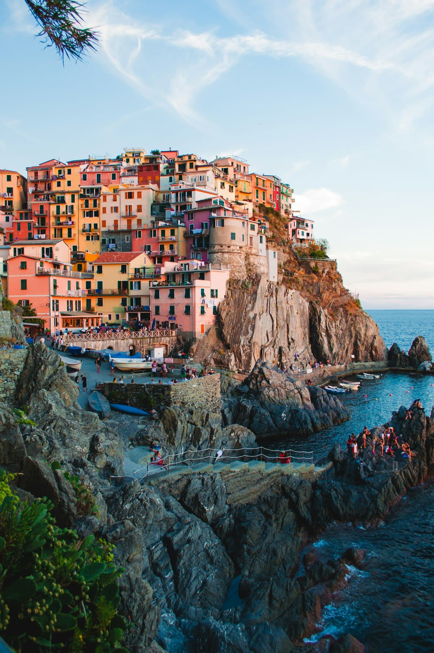 Colorful houses stacked on a cliff above the sea in Cinque Terre, Italy